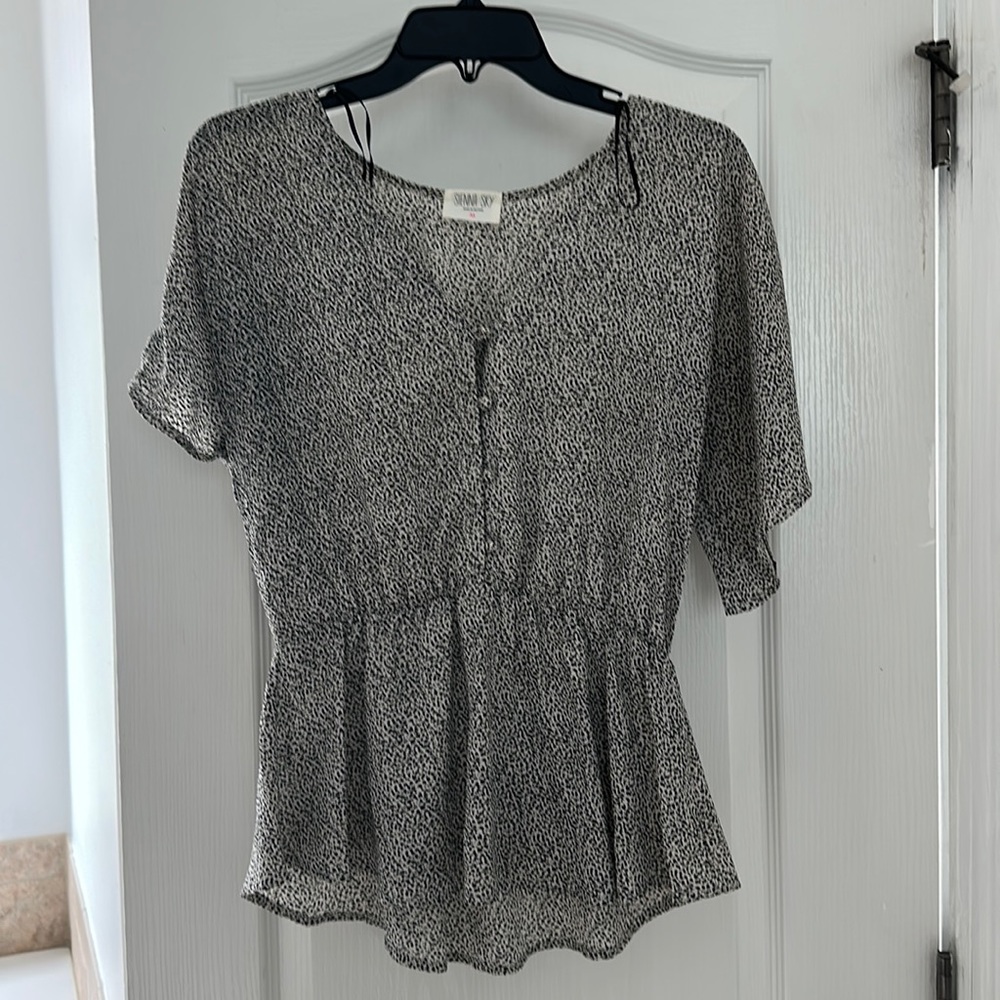 Peplum spotted top